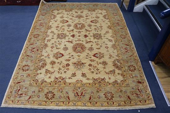 A cream ground rug 235 x 170cm